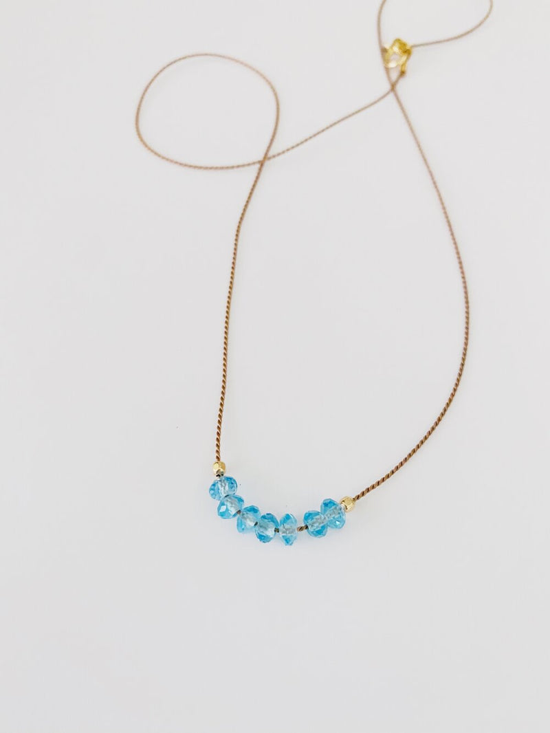 Faceted Blue Topaz on Silk Cord Necklace